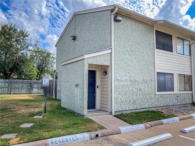 exterior space featuring a front yard