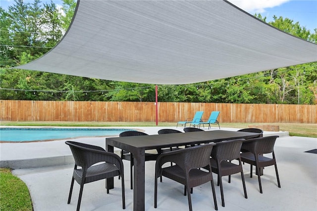 view of patio featuring a fenced in pool