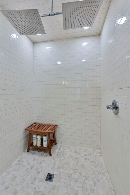 bathroom with tiled shower