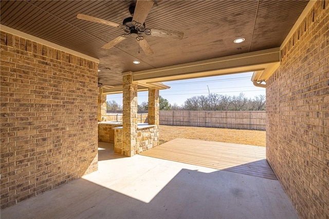 view of patio featuring ceiling fan and exterior kitchen