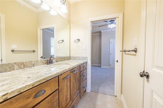 bathroom with crown molding, tile patterned floors, and vanity