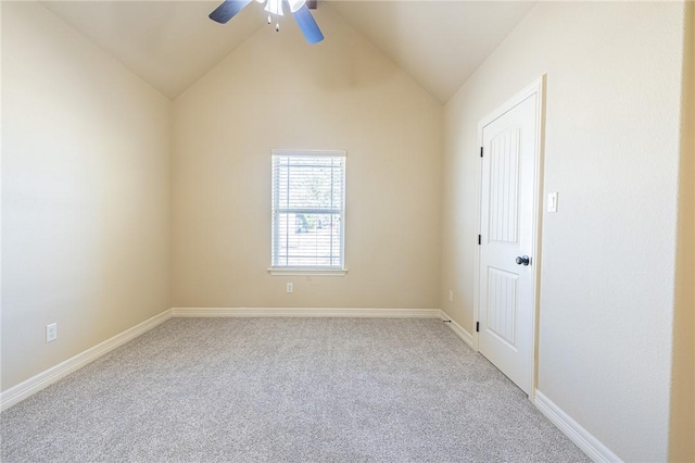 carpeted empty room featuring lofted ceiling and ceiling fan