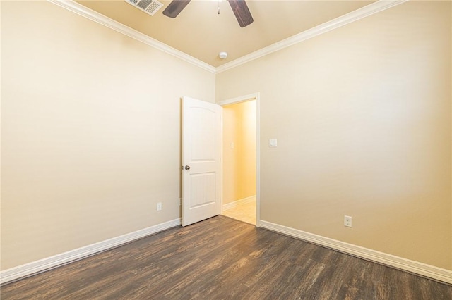 spare room with ceiling fan, ornamental molding, and dark hardwood / wood-style floors