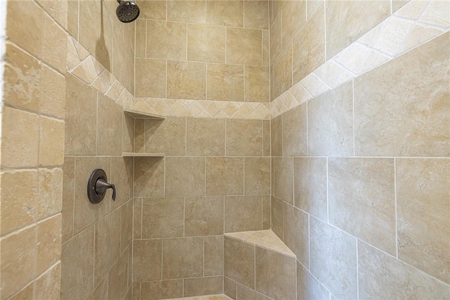 bathroom with tiled shower