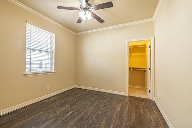 unfurnished room with crown molding, ceiling fan, and dark hardwood / wood-style flooring