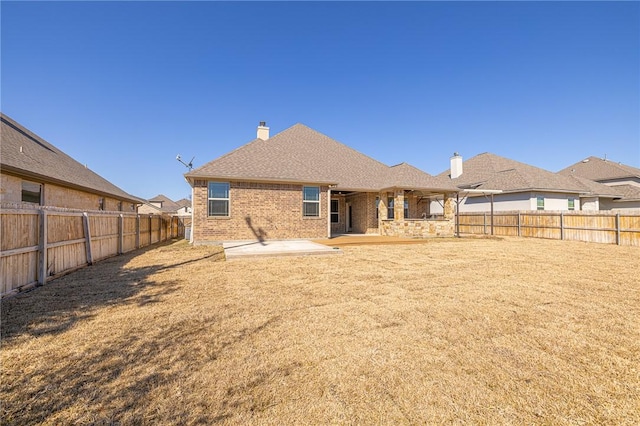 back of property with a patio