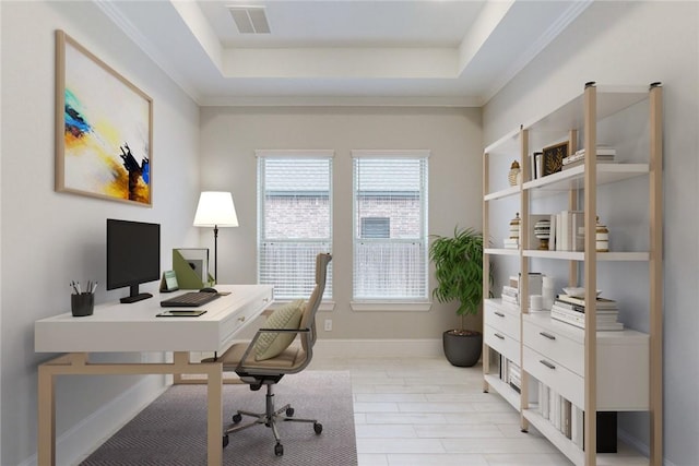 office featuring a tray ceiling and crown molding