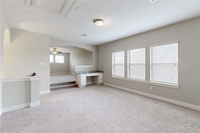 spare room featuring light colored carpet