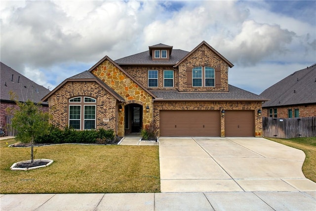 view of front of house with a garage and a front yard