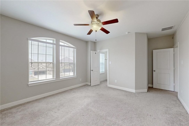 unfurnished bedroom featuring light carpet and ceiling fan