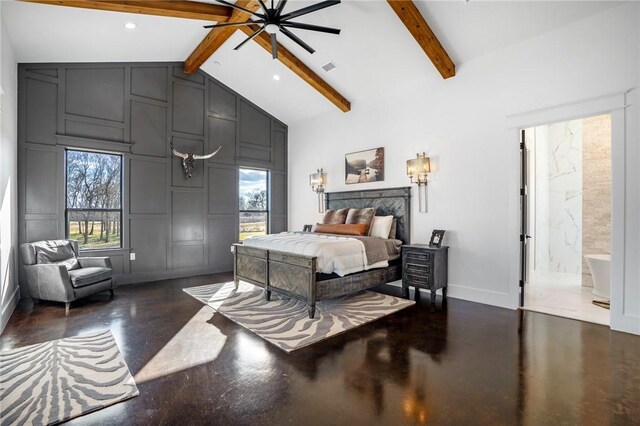 bedroom with multiple windows, beamed ceiling, and ensuite bath