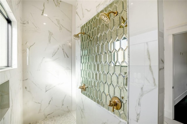 interior details featuring tiled shower