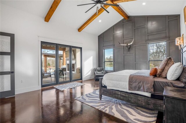 bedroom with beamed ceiling, access to outside, and multiple windows