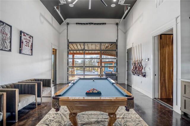 playroom featuring a towering ceiling and pool table