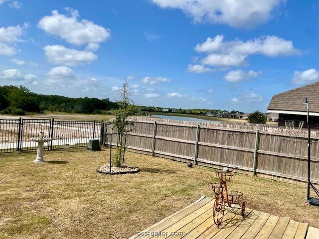 6336 Spartan Dr, College Station, TX 77845 - view of yard featuring a deck with water view
