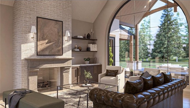 living room with hardwood / wood-style floors, a fireplace, and high vaulted ceiling