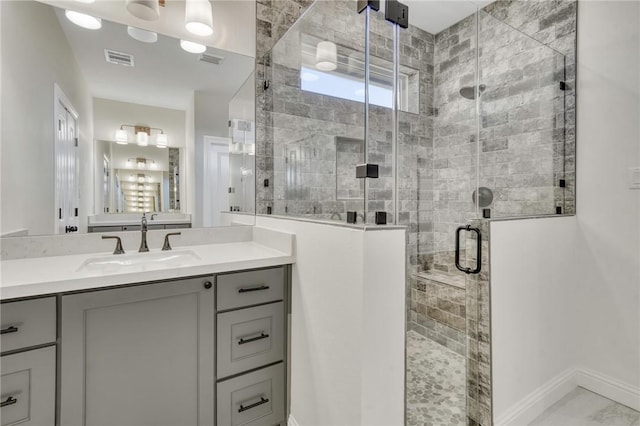 bathroom with vanity and an enclosed shower