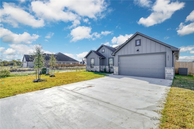 view of front of property featuring a front yard and a garage