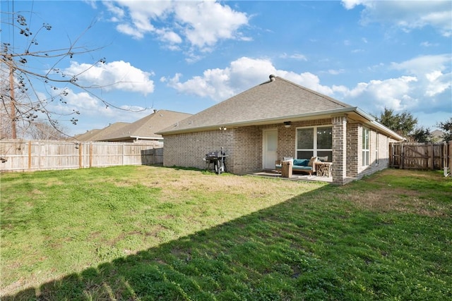 back of house with a lawn