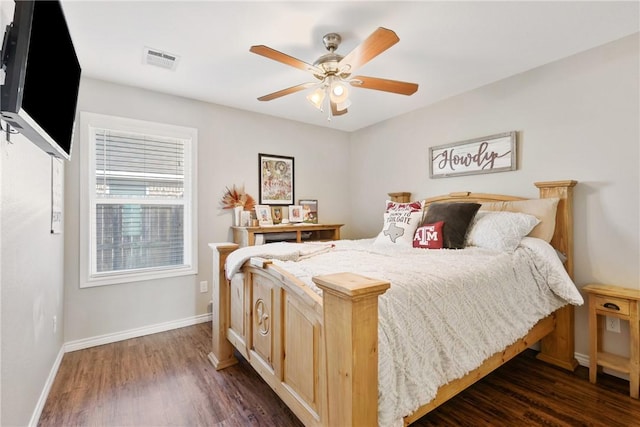 bedroom with ceiling fan and dark hardwood / wood-style flooring