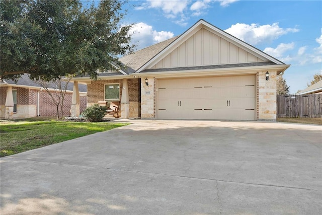 view of front of home with a garage and a front yard