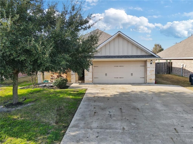 view of front of home with a garage and a front lawn