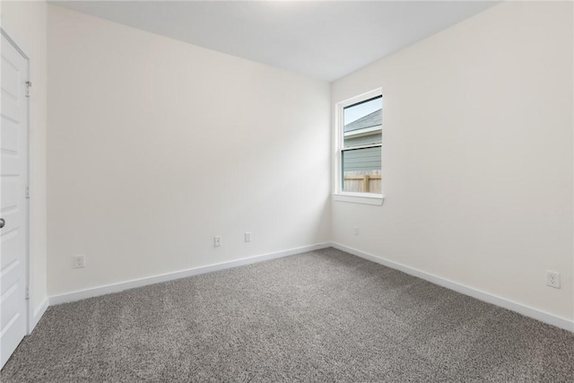 unfurnished room with carpet flooring