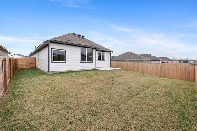 back of property featuring a patio and a lawn