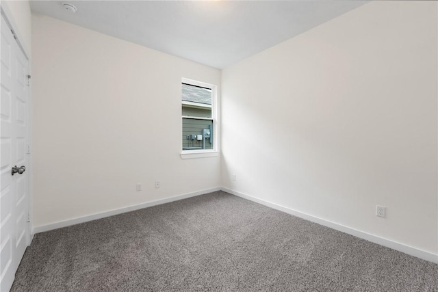 spare room featuring carpet floors