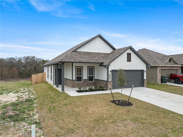 view of front of home featuring a garage and a front lawn