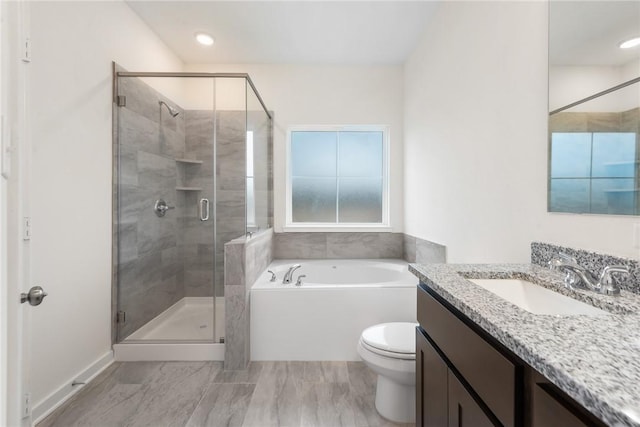 full bathroom with vanity, toilet, and independent shower and bath