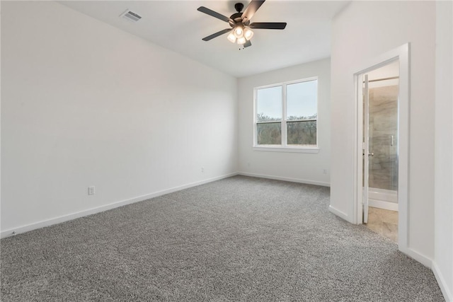 unfurnished bedroom featuring ensuite bathroom, carpet floors, and ceiling fan