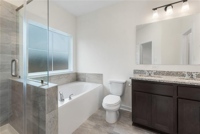 full bathroom featuring vanity, toilet, and independent shower and bath