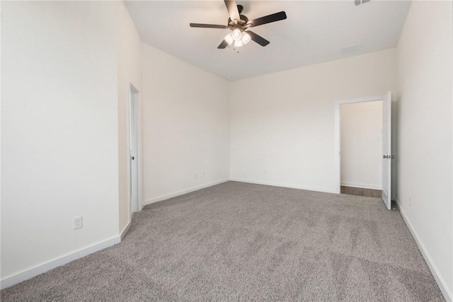 carpeted empty room with ceiling fan