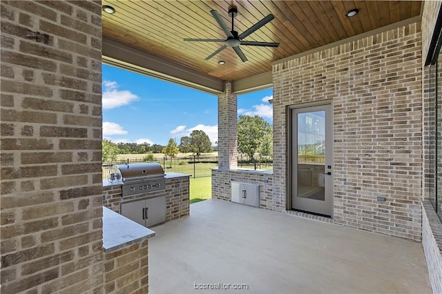 view of patio featuring ceiling fan and area for grilling