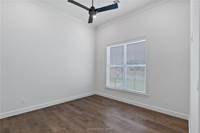 empty room featuring ceiling fan, ornamental molding, and dark wood-type flooring