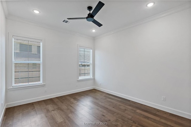 unfurnished room with ceiling fan, dark hardwood / wood-style flooring, and crown molding