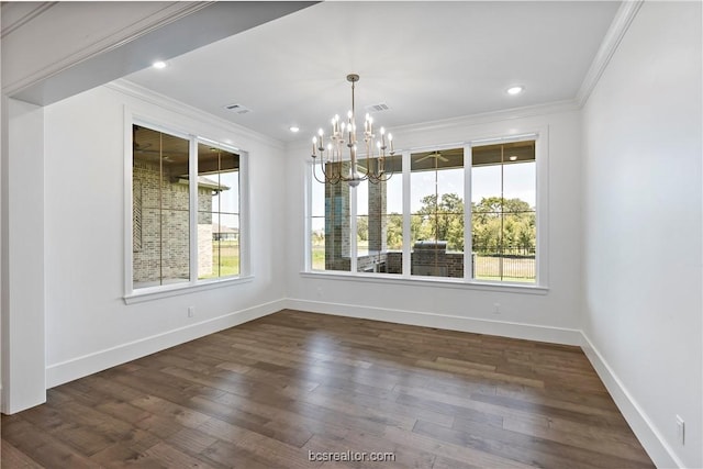 unfurnished dining area featuring a chandelier, crown molding, and dark wood-type flooring