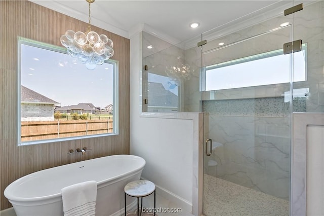 bathroom with crown molding, a notable chandelier, and shower with separate bathtub