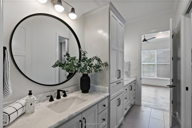 bathroom featuring tile patterned flooring, ceiling fan, ornamental molding, and vanity