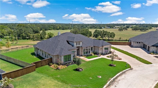 exterior space featuring a front yard and a rural view