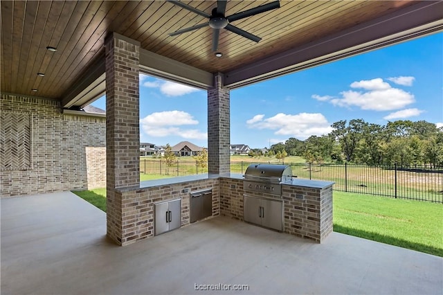 view of patio / terrace featuring an outdoor kitchen, area for grilling, and ceiling fan