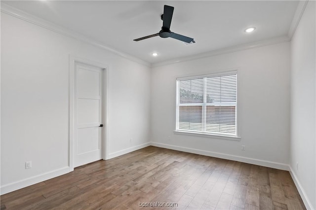 spare room with ceiling fan, hardwood / wood-style floors, and crown molding