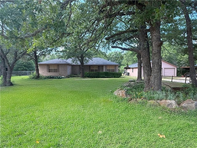 7704 Deer Trail Dr, Bryan, TX 77807 - view of front of house with a garage and concrete driveway