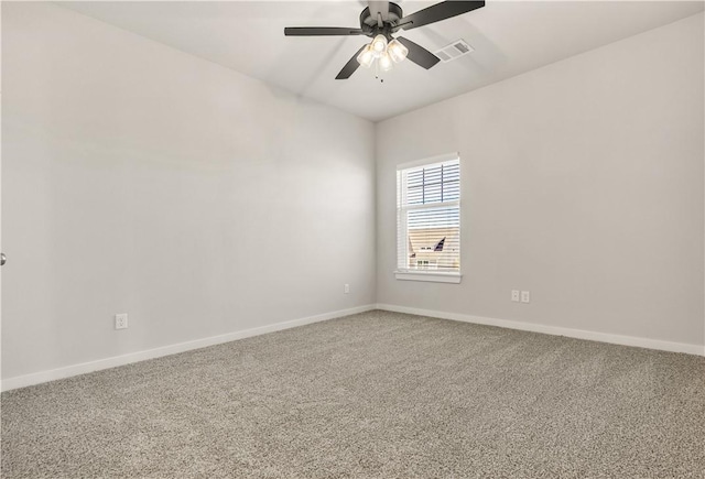 carpeted spare room with ceiling fan