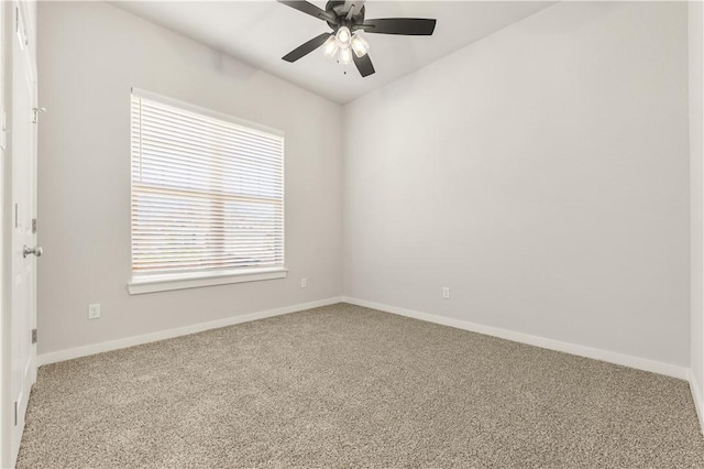 empty room featuring carpet flooring, plenty of natural light, and ceiling fan