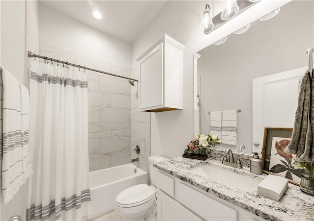 full bathroom with vanity, toilet, and shower / tub combo with curtain