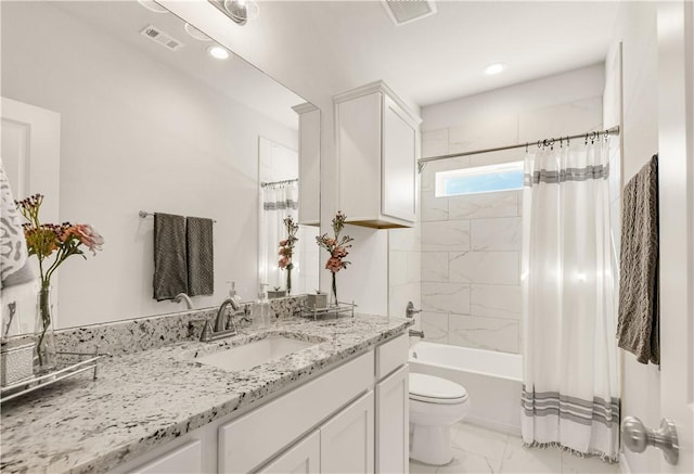 full bathroom featuring shower / tub combo with curtain, vanity, and toilet