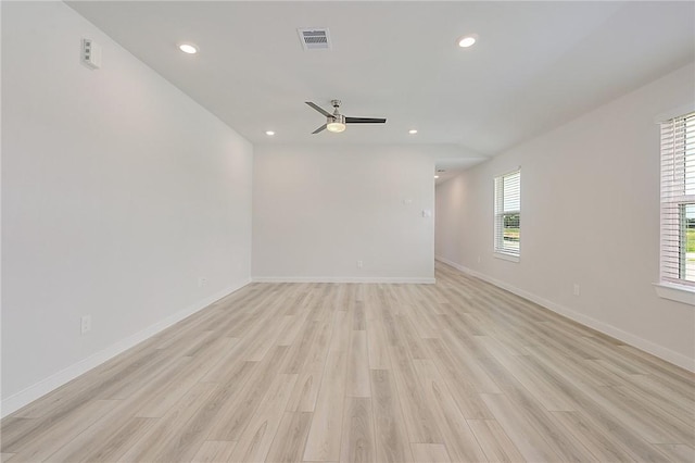 unfurnished room with a wealth of natural light, visible vents, and recessed lighting