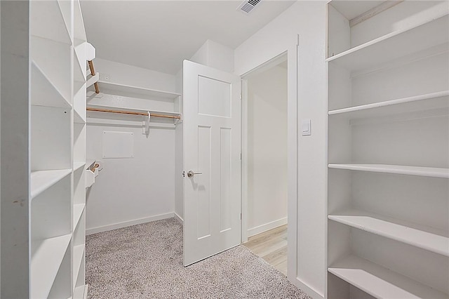 walk in closet featuring visible vents